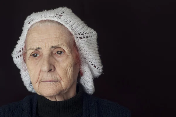 Portrait of a sad old woman