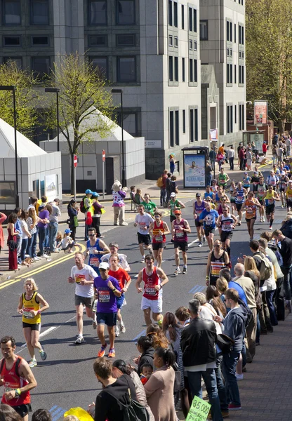 LONDON, UK - APRIL 13, 2014 - London Marathon in Canary Wharf aria, massive sport event for professionals and amateurs sportsmen, Champions League