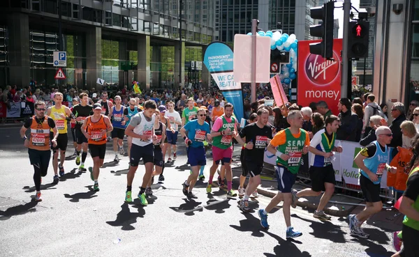 LONDON, UK - APRIL 13, 2014 - London Marathon in Canary Wharf aria, massive sport event for professionals and amateurs sportsmen, Champions League