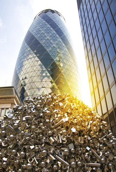 LONDON, UK - APRIL 24, 2014: Gherkin building glass windows texture reflects the sky buildings of the Swiss Re Gherkin, is 180 meters tall, stands in the City of London