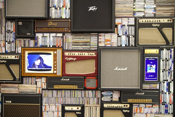 LONDON, UK - MAY 18, 2014  Decorative front panel, background made of old radio, TV, collection of dicks and video tapes