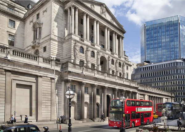 LONDON, UK - JUNE 30, 2014: Bank of England. Square with traffic and office workers