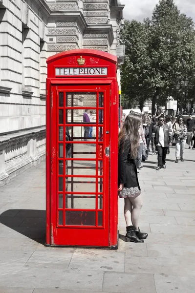 LONDON, UK - MAY 14, 2014: British red telephone box near Westminster tube station, London