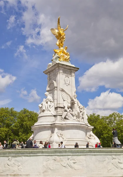 LONDON, UK - JULY 14, 2014: The Victoria Memorial is a sculpture dedicated to Queen Victoria, created by Sir Thomas Brock. Placed at the centre of Queen\'s Gardens in front of Buckingham Palace.