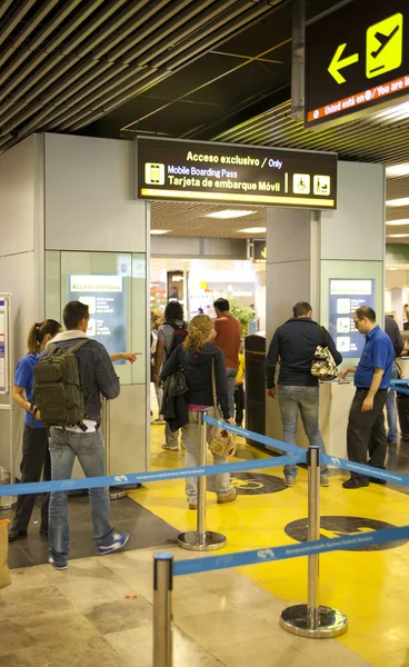 MADRID, SPAIN - MAY 28, 2014: Interior of Madrid airport, queue in departure waiting aria