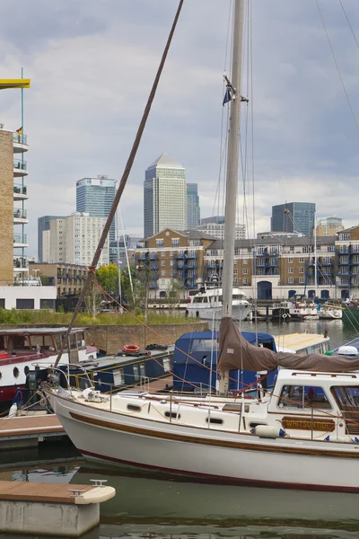 LONDON, UK - 3 JUNE 2014: Limehouse basin in the centre of London, private bay for boats and yatches and flats with Canary Wharf view