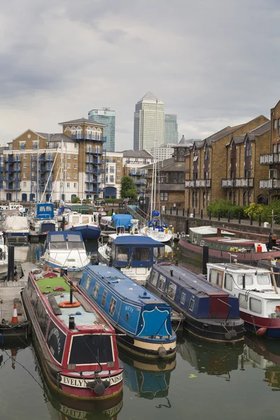 LONDON, UK - 3 JUNE 2014: Limehouse basin in the centre of London, private bay for boats and yatches and flats with Canary Wharf view