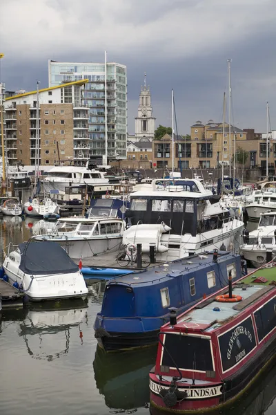 LONDON, UK - 3 JUNE 2014: Limehouse basin in the centre of London, private bay for boats and yatches and flats with Canary Wharf view