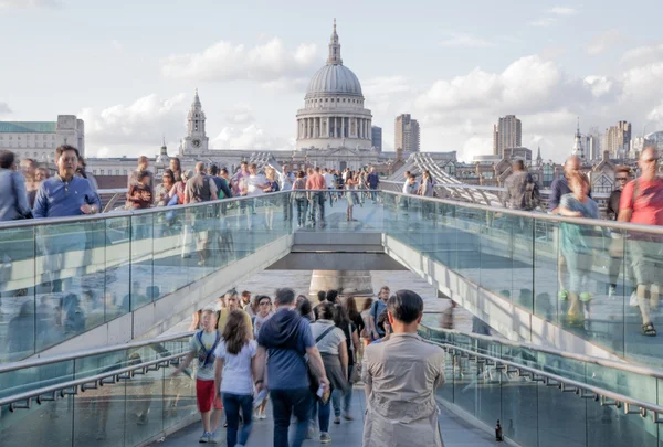 LONDON, UK - AUGUST 9, 2014: South bank walk of the river Thames. St. Paul's cathedral. View on bridge and modern architecture