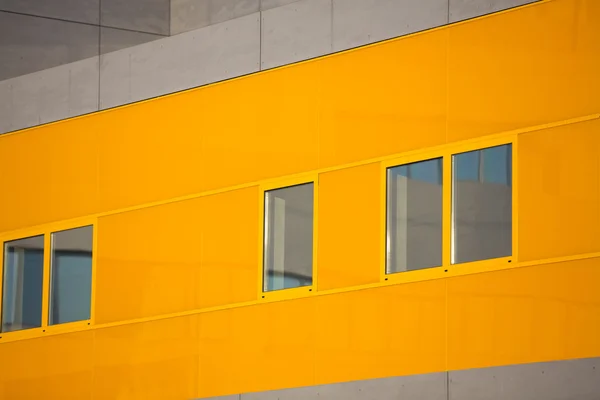 Modern office buildings. Colorful buildings in a industrial place. Orange windows.