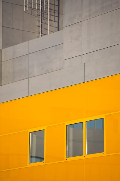 Modern office buildings. Colorful buildings in a industrial place. Orange windows.