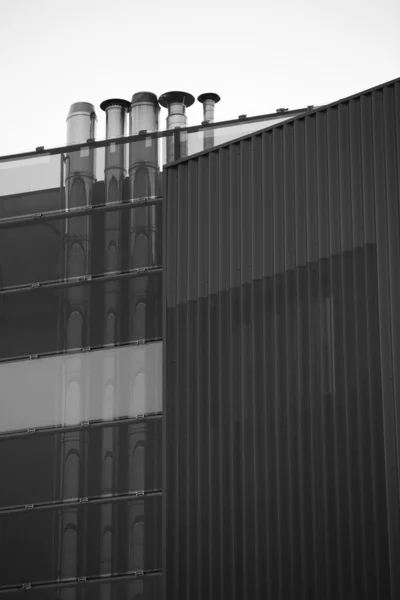 Chimney modern building with sky blue. Black and white image.