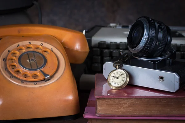 Old watch, old telephone, old camera, type writer