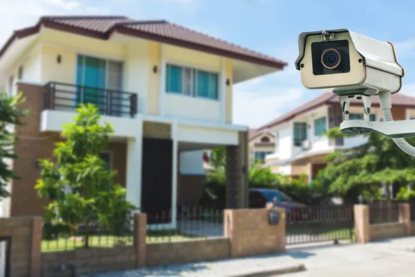 CCTV Camera with house and village in background