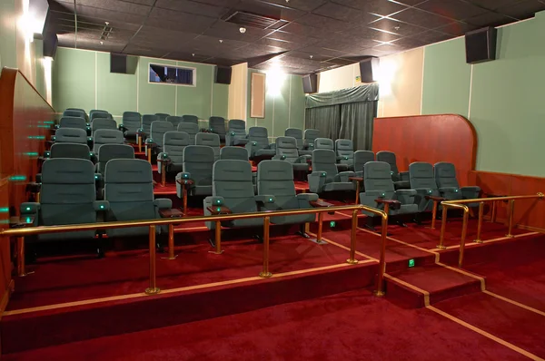 VIP Hall of a cinema and lines of green armchairs