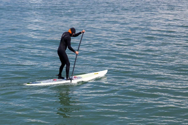 Paddling surf board out of Sausalito marina