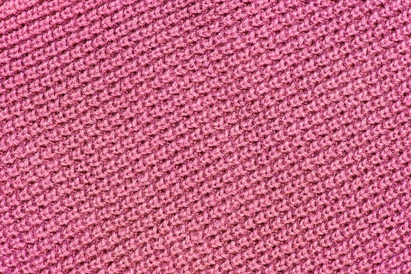 Pink wool knitted textured background