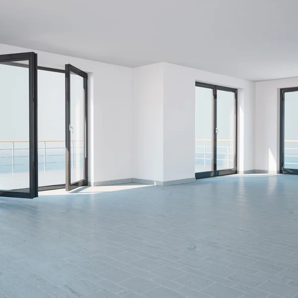 Bright empty room with large windows and a balcony