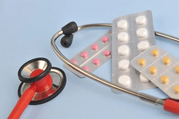 Doctors Stethoscope with pills and tablets treatment