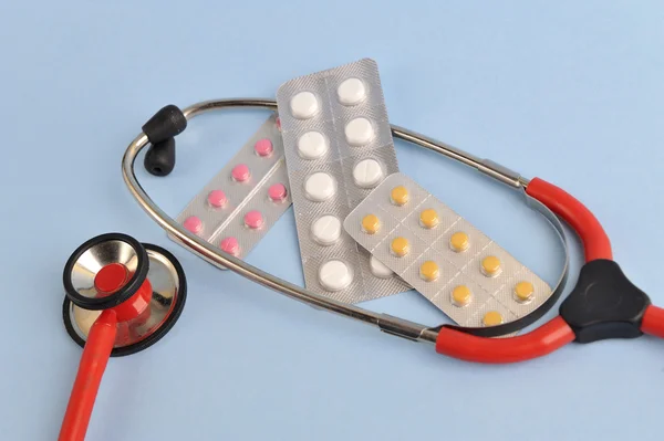 Doctors Stethoscope with pills and tablets treatment