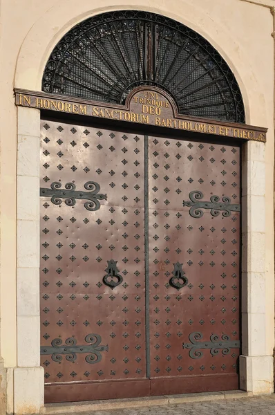 Doors with bronze door knockers