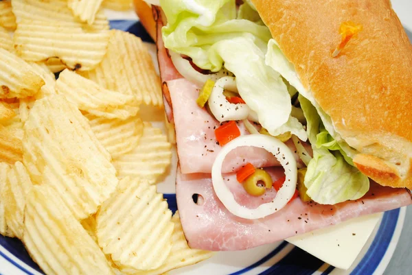 Ham and Veggie Sandwich Served with Potato Chips