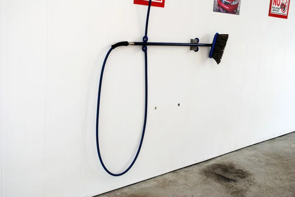 Car Wash Hose Hanging on a Wall