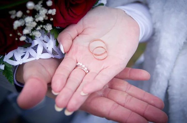 Wedding rings fall on hand