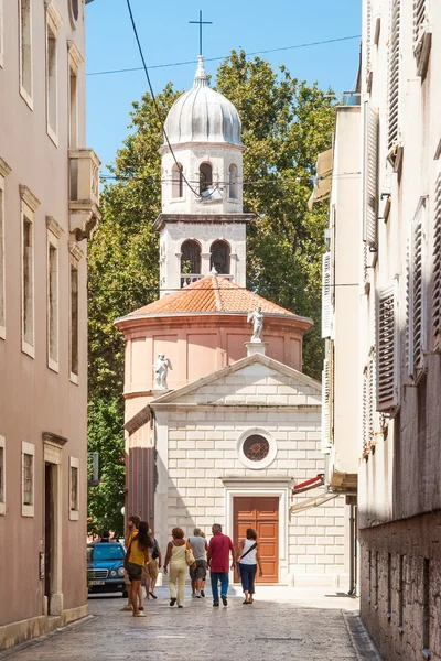 Tourists walking on Kalelarga, the main street in old Zadar city center