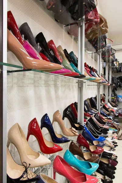 Rows of beautiful women's shoes on store shelves