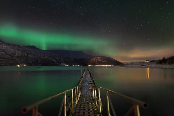 Aurora borealis over a norwegian fjord