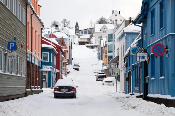 Empty street of Tromso covered by snow