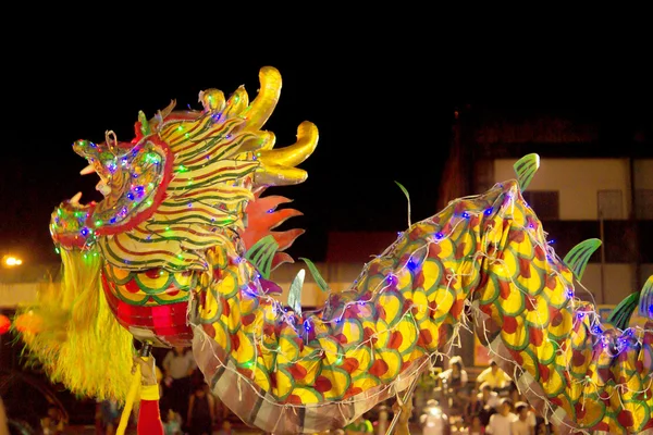 Acrobats are performing a lion and dragon dance