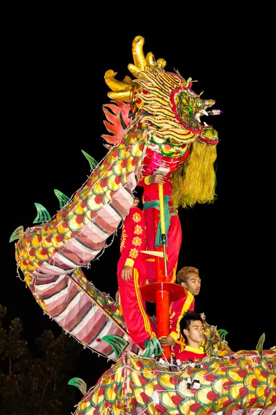 Acrobats are performing a lion and dragon dance