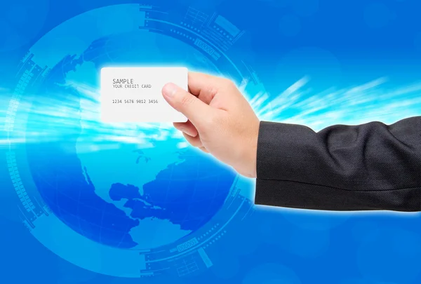 Man hand show credit card around the world