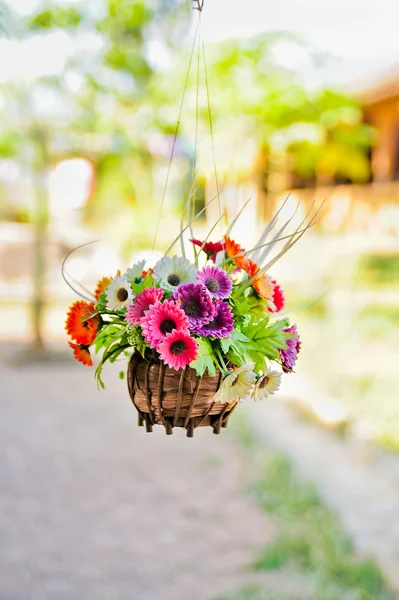 Hanging basket of artificial flowers