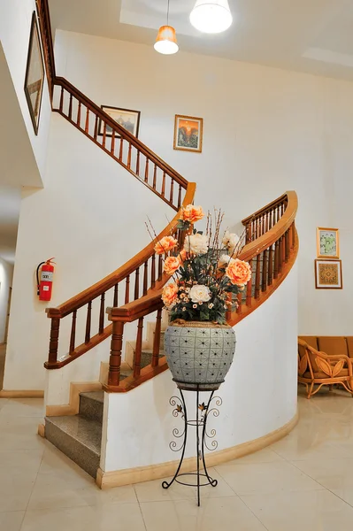 Vase and Marble stairs with wooden railing