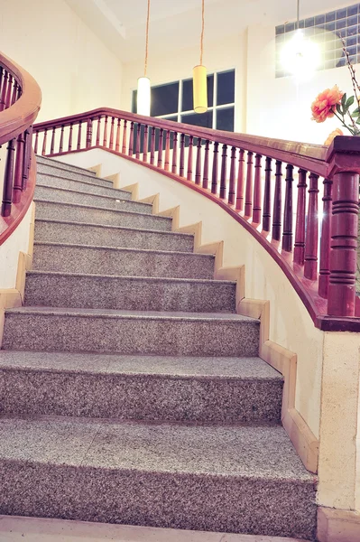 Marble stairs with wooden railing