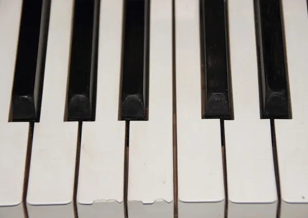 One octave on old piano with broken key