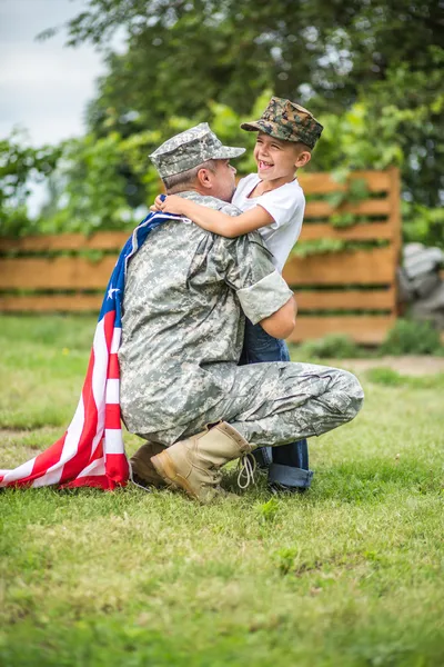 Father hugs his son. American family