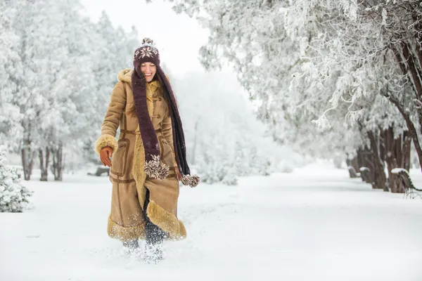 Beautiful winter woman walking