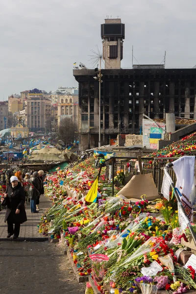 KIEV, UKRAINE - MARCH 7, 2014. Ukrainian revolution, Euromaidan. Days of national mourning for killed defenders of Euromaidan. Flowers and lighted lamps on barricades defenders of Euromaidan