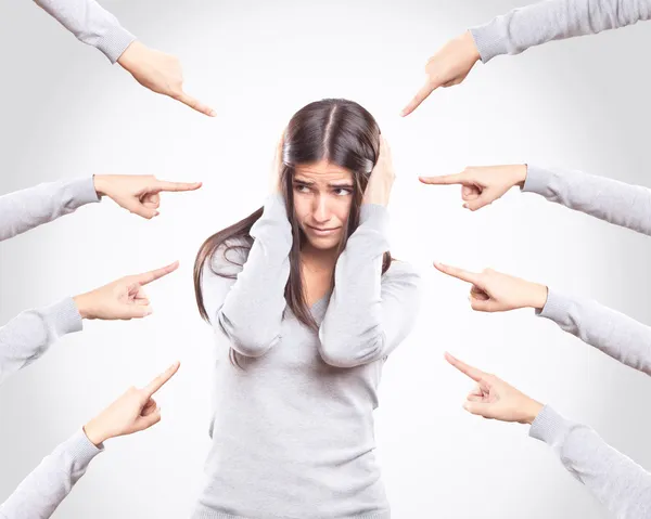 Worried young woman being accused