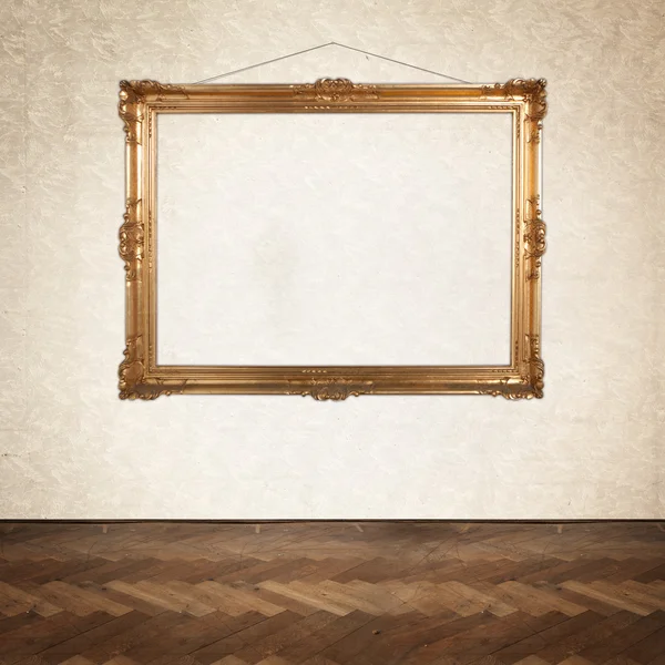 Empty painting frame on the wall