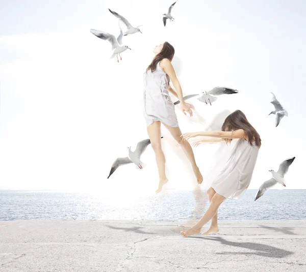 Young girl with seagulls, separation of the soul concept