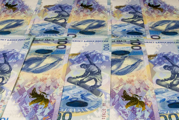 Background. Commemorative banknotes100 rubles to the 2014 Winter Olympic games in Sochi