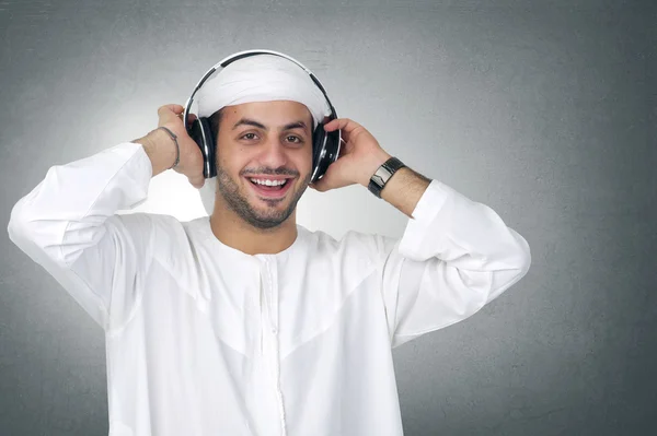 Arabian man listening music — Stock Photo #41074579