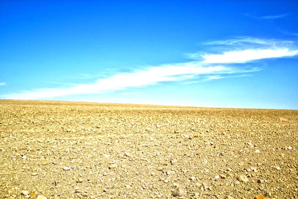 Farmland with blue sky horizon