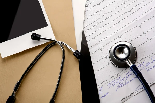 File folder and medical stethoscope