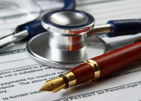 Stethoscope on medical billing statement